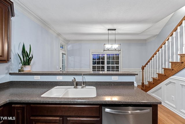 kitchen with dishwasher, dark brown cabinets, sink, and ornamental molding