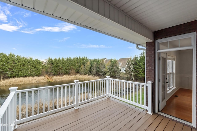 deck featuring a water view
