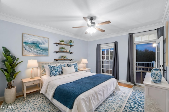 bedroom featuring light hardwood / wood-style flooring, ceiling fan, and ornamental molding