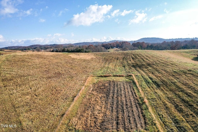 drone / aerial view with a mountain view and a rural view