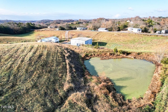 birds eye view of property with a rural view