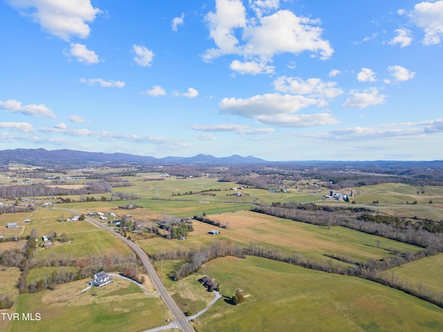 birds eye view of property with a mountain view and a rural view