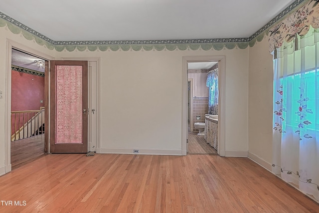 unfurnished room with light hardwood / wood-style floors