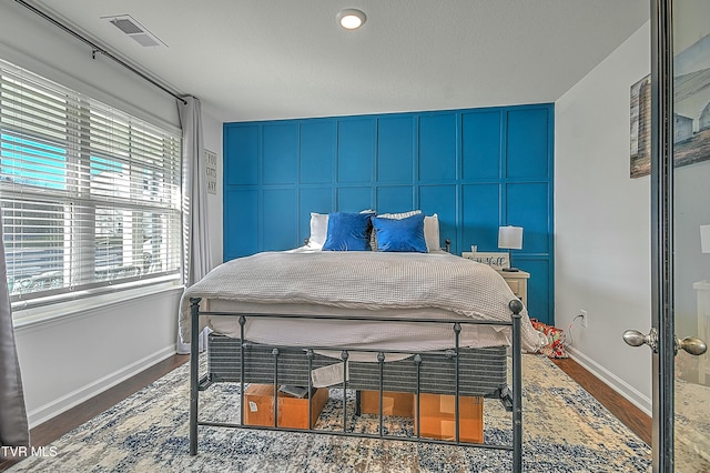 bedroom featuring dark wood-type flooring