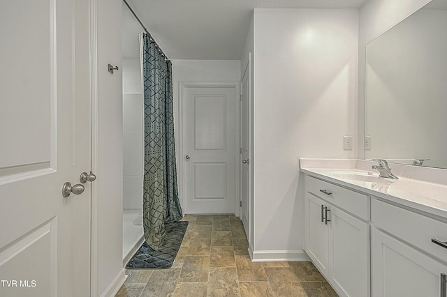 bathroom with a shower with curtain and vanity