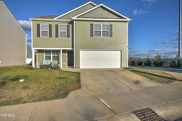 view of front of property featuring a garage and a front yard