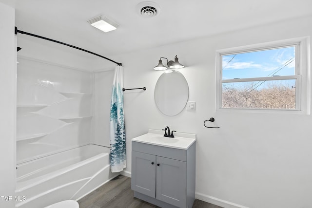 bathroom featuring shower / tub combo, vanity, and hardwood / wood-style flooring