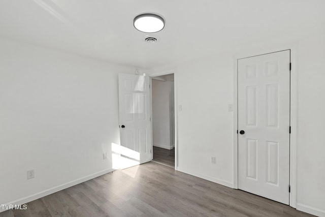 unfurnished room with light hardwood / wood-style flooring