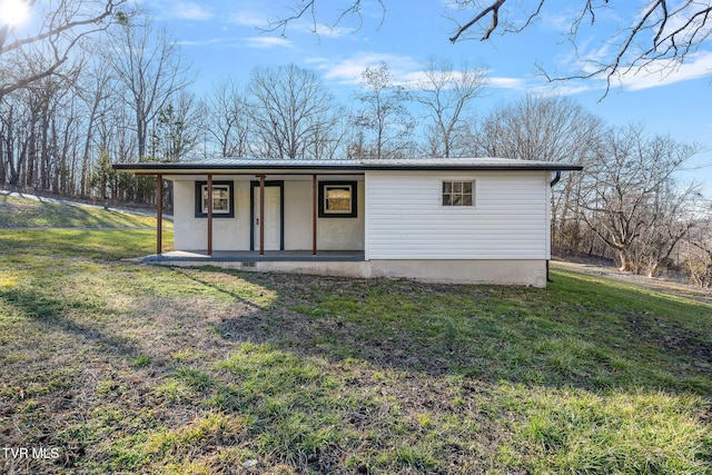 view of outbuilding featuring a lawn