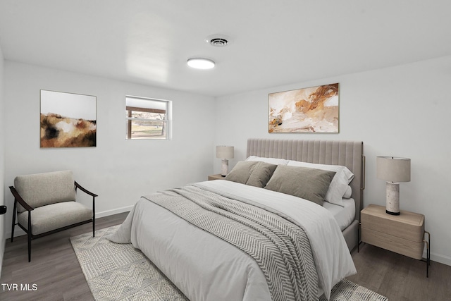 bedroom with wood-type flooring