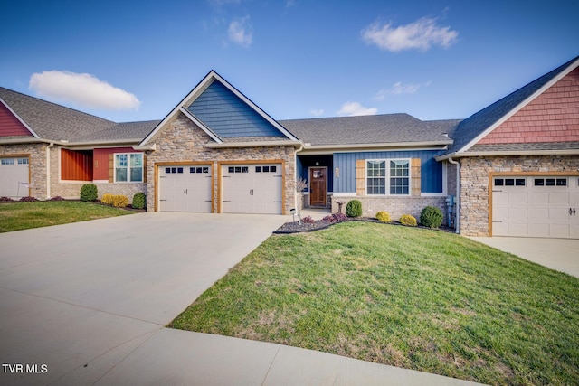 craftsman-style house with a garage and a front lawn