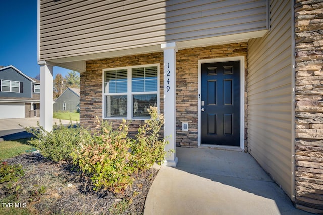 property entrance with covered porch