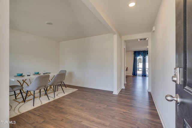 dining area with dark hardwood / wood-style floors