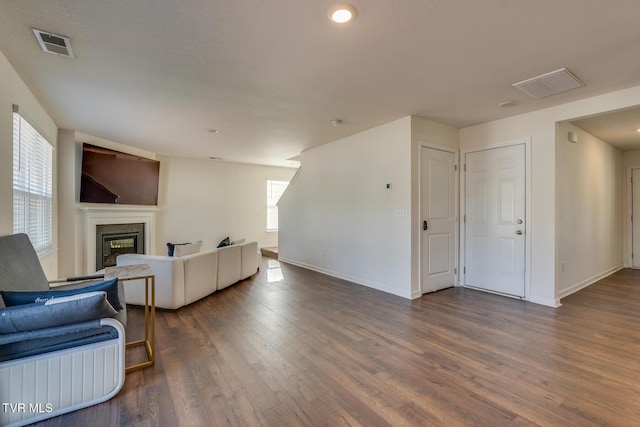 living room with dark wood-type flooring