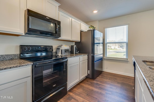 kitchen featuring white cabinetry, black appliances, and dark hardwood / wood-style floors