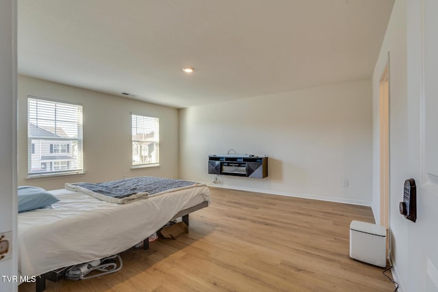 bedroom with light hardwood / wood-style floors