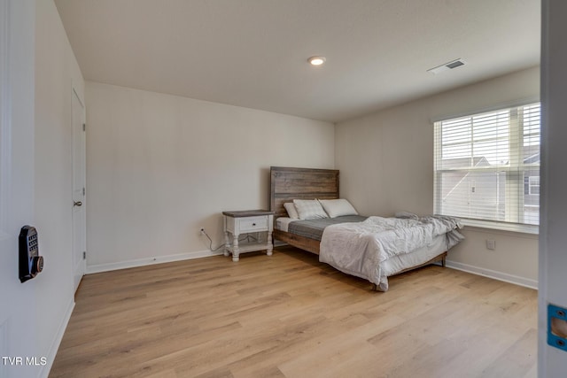 bedroom with light hardwood / wood-style floors