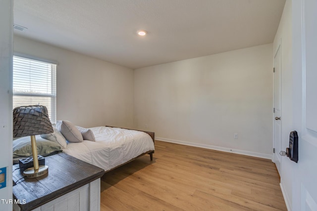 bedroom featuring light hardwood / wood-style floors