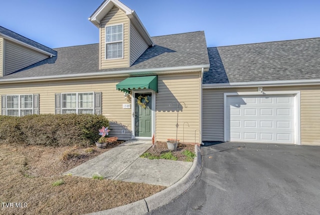 1505 Kensington Pl Unit 1505, Johnson City, TN 37615 - view of front facade featuring an attached garage, asphalt driveway, and roof with shingles