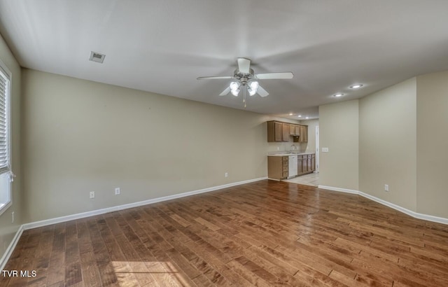 1505 Kensington Pl Unit 1505, Johnson City, TN 37615 - unfurnished living room with wood finished floors, a ceiling fan, baseboards, and recessed lighting