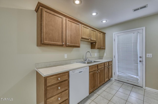 1505 Kensington Pl Unit 1505, Johnson City, TN 37615 - kitchen with white dishwasher, a sink, light countertops, light tile patterned floors, and recessed lighting