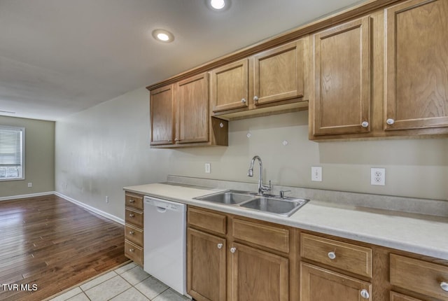 1505 Kensington Pl Unit 1505, Johnson City, TN 37615 - kitchen featuring a sink, white dishwasher, light countertops, brown cabinetry, and recessed lighting