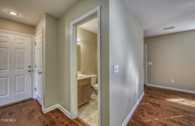 1505 Kensington Pl Unit 1505, Johnson City, TN 37615 - hallway featuring dark wood finished floors, baseboards, and recessed lighting