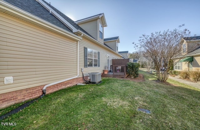 1505 Kensington Pl Unit 1505, Johnson City, TN 37615 - view of home's exterior featuring a yard, central AC unit, and roof with shingles