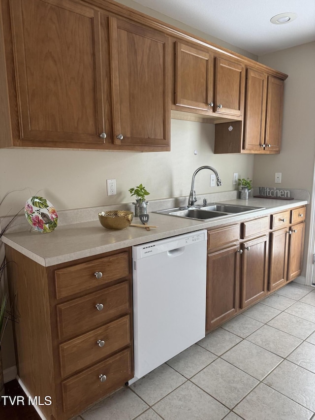1505 Kensington Pl Unit 1505, Johnson City, TN 37615 - kitchen with white dishwasher, a sink, light tile patterned floors, and light countertops