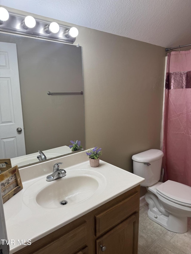 1505 Kensington Pl Unit 1505, Johnson City, TN 37615 - full bathroom with vanity, toilet, a textured ceiling, a shower with shower curtain, and tile patterned floors