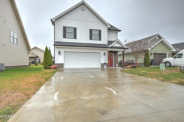 view of front of house with a front yard, a garage, and central AC unit