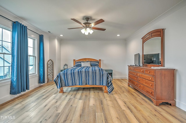 bedroom featuring ceiling fan, light wood-type flooring, and ornamental molding