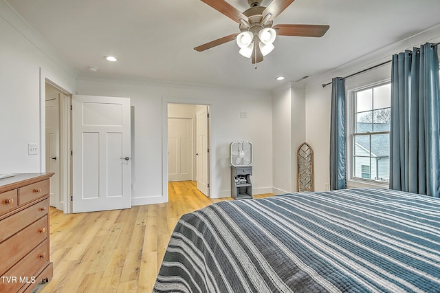 bedroom featuring light wood-type flooring, ceiling fan, and crown molding