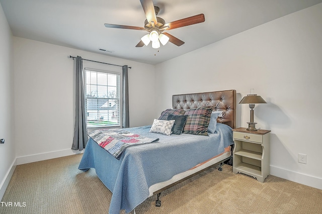 bedroom with ceiling fan and light colored carpet