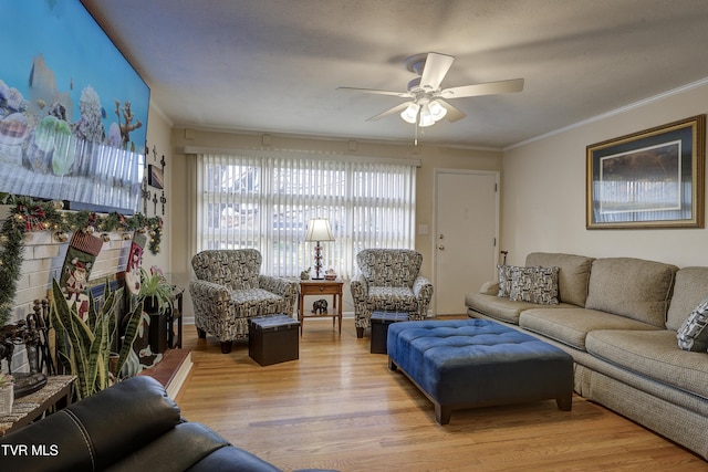 living room with ceiling fan, light hardwood / wood-style floors, and ornamental molding