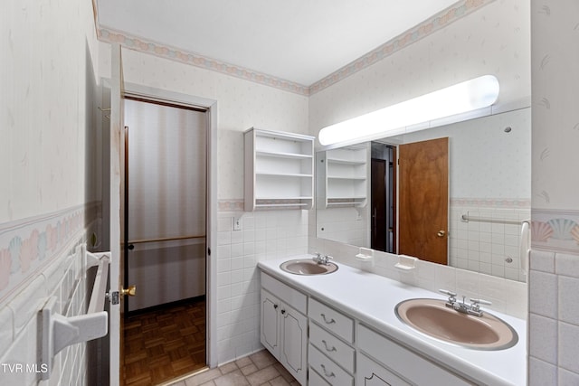 bathroom featuring vanity, tile walls, and parquet flooring