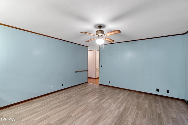 empty room with light hardwood / wood-style flooring, ceiling fan, and crown molding