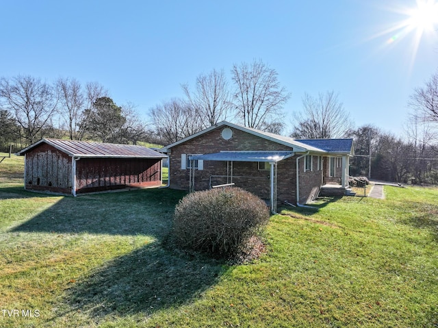 view of side of property with a yard