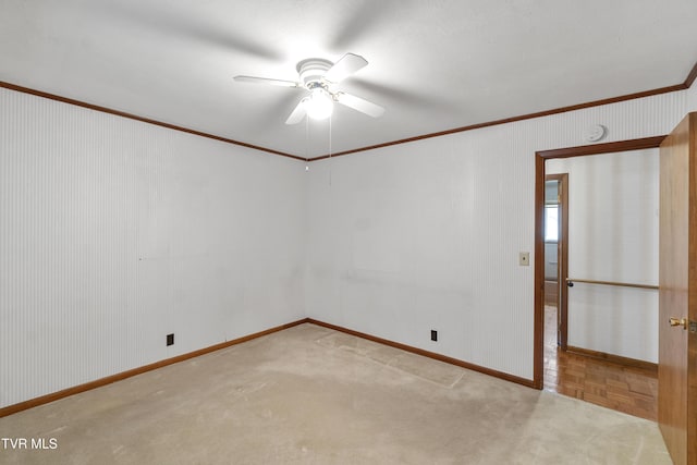 unfurnished room featuring ceiling fan, ornamental molding, and light parquet flooring