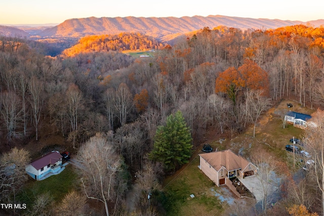 aerial view at dusk featuring a mountain view