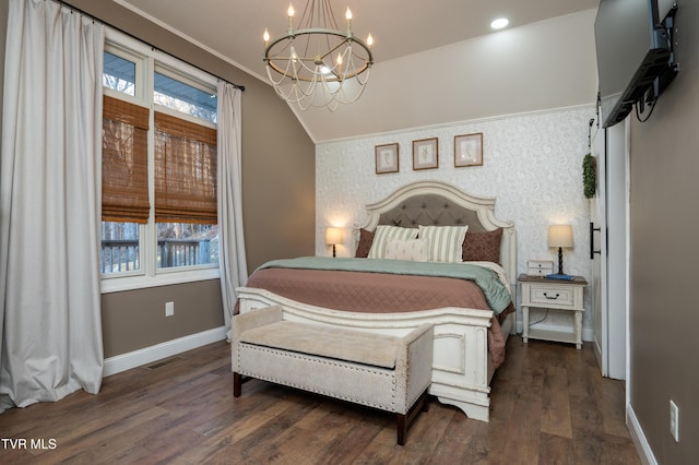 bedroom with multiple windows, dark hardwood / wood-style flooring, a chandelier, and vaulted ceiling