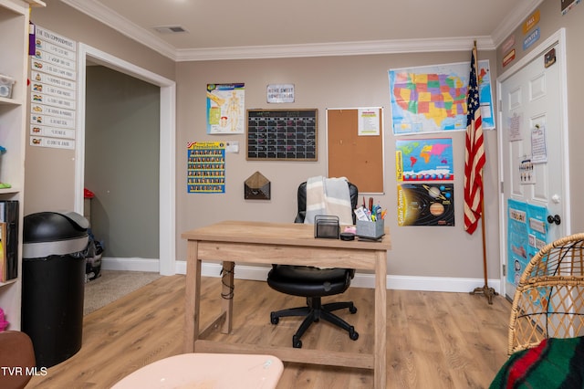 office with light hardwood / wood-style flooring and ornamental molding