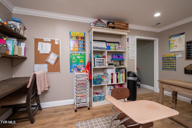 office area featuring hardwood / wood-style floors and ornamental molding