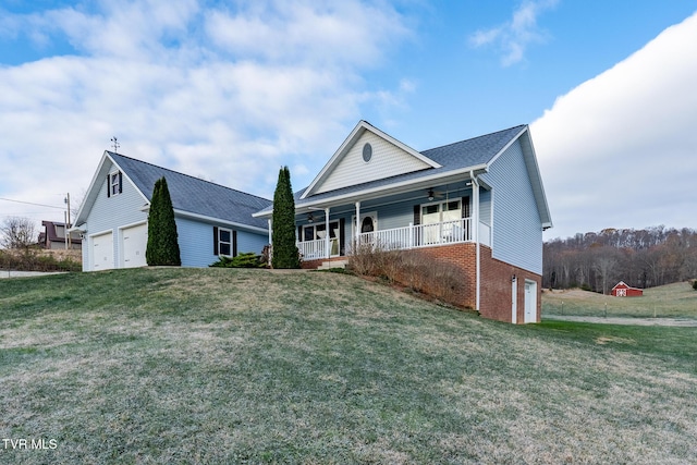 view of front of property with a porch, a garage, and a front yard