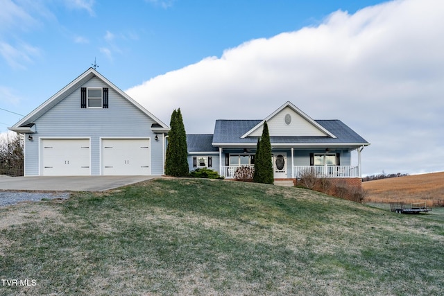 view of front of property featuring ceiling fan, a garage, covered porch, and a front lawn