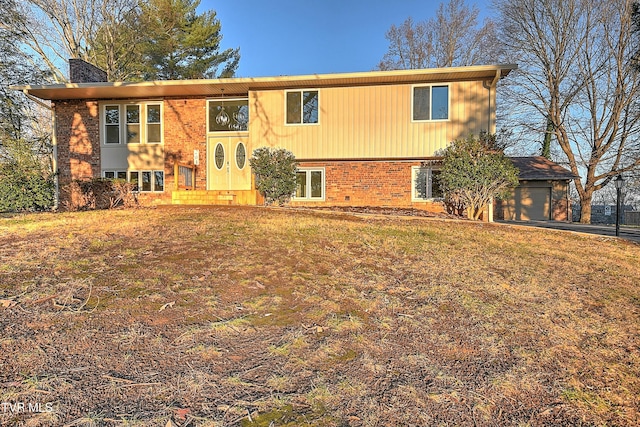 bi-level home with a front yard