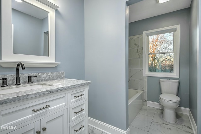 full bathroom with marble finish floor, toilet, vanity, and baseboards