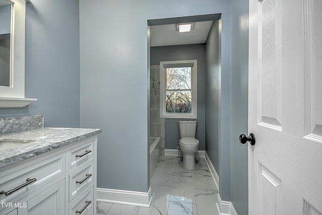 bathroom featuring vanity, washtub / shower combination, baseboards, toilet, and marble finish floor