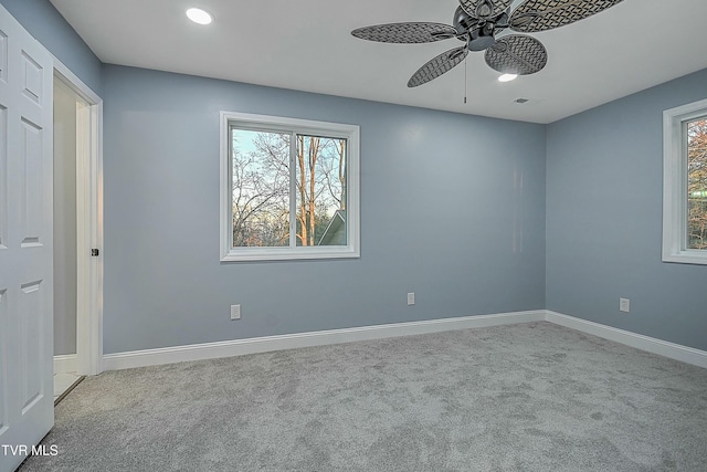 carpeted empty room with recessed lighting, visible vents, baseboards, and a ceiling fan