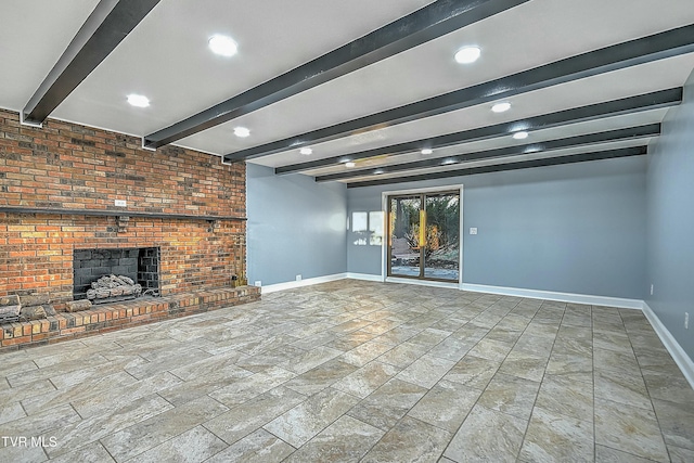 unfurnished living room with beamed ceiling, recessed lighting, a brick fireplace, and baseboards